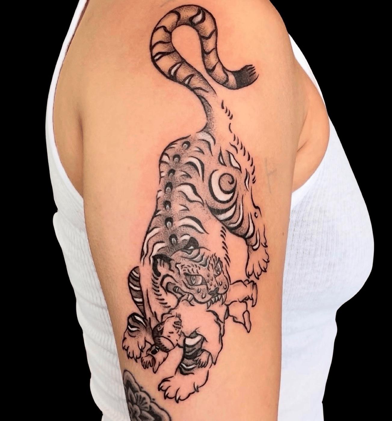 Japanese traditional tiger tattoo on the upper arm