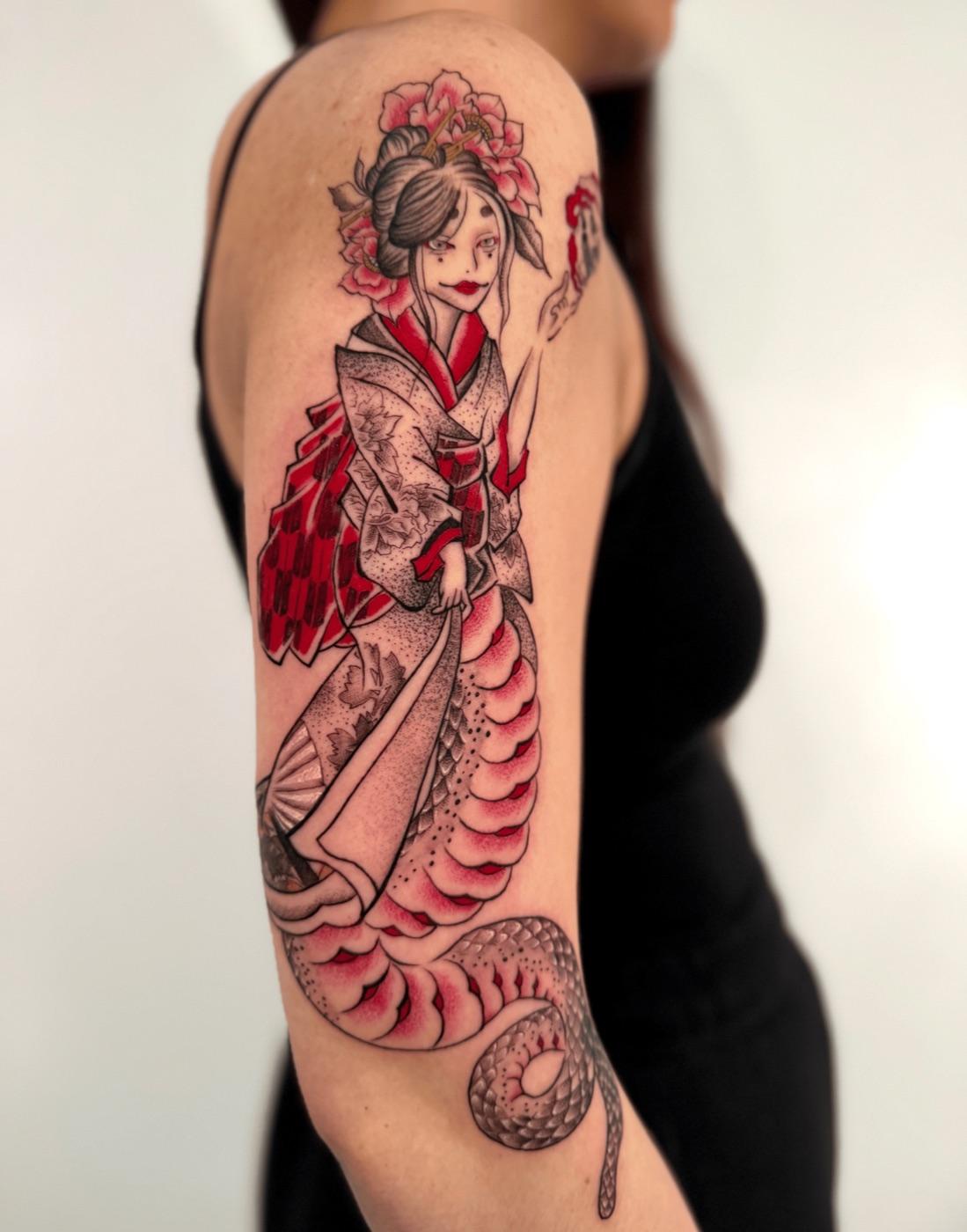 Traditional woman and snake tattoo